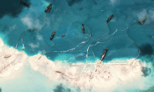 Chinese ships build an island, where only rocks existed at Mischief Reef. http://www.nytimes.com/interactive/2015/07/30/world/asia/what-china-has-been-building-in-the-south-china-sea.html