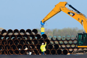 "Pipes being stacked for the Dakota Access oil pipeline last year at a staging site in Worthing, S.D." Credit: Nati Harnik/Associated Press
